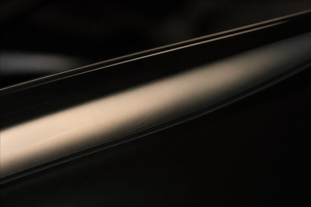 Macro view of glossy piano-black automotive trim