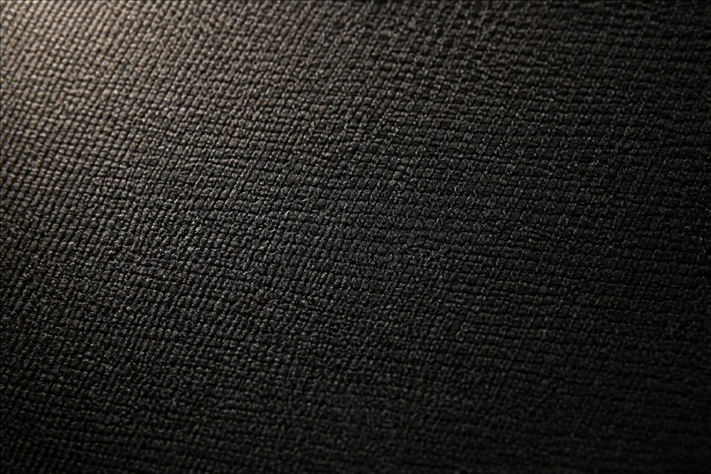 Macro view of dark woven automotive seat textile